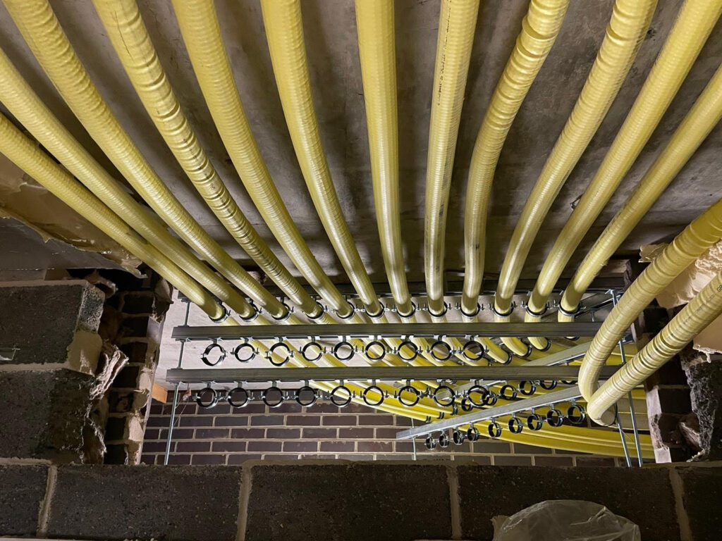 Milo and Diagoras Houses, Bow, East London. 66 New Gas Mains Replaced